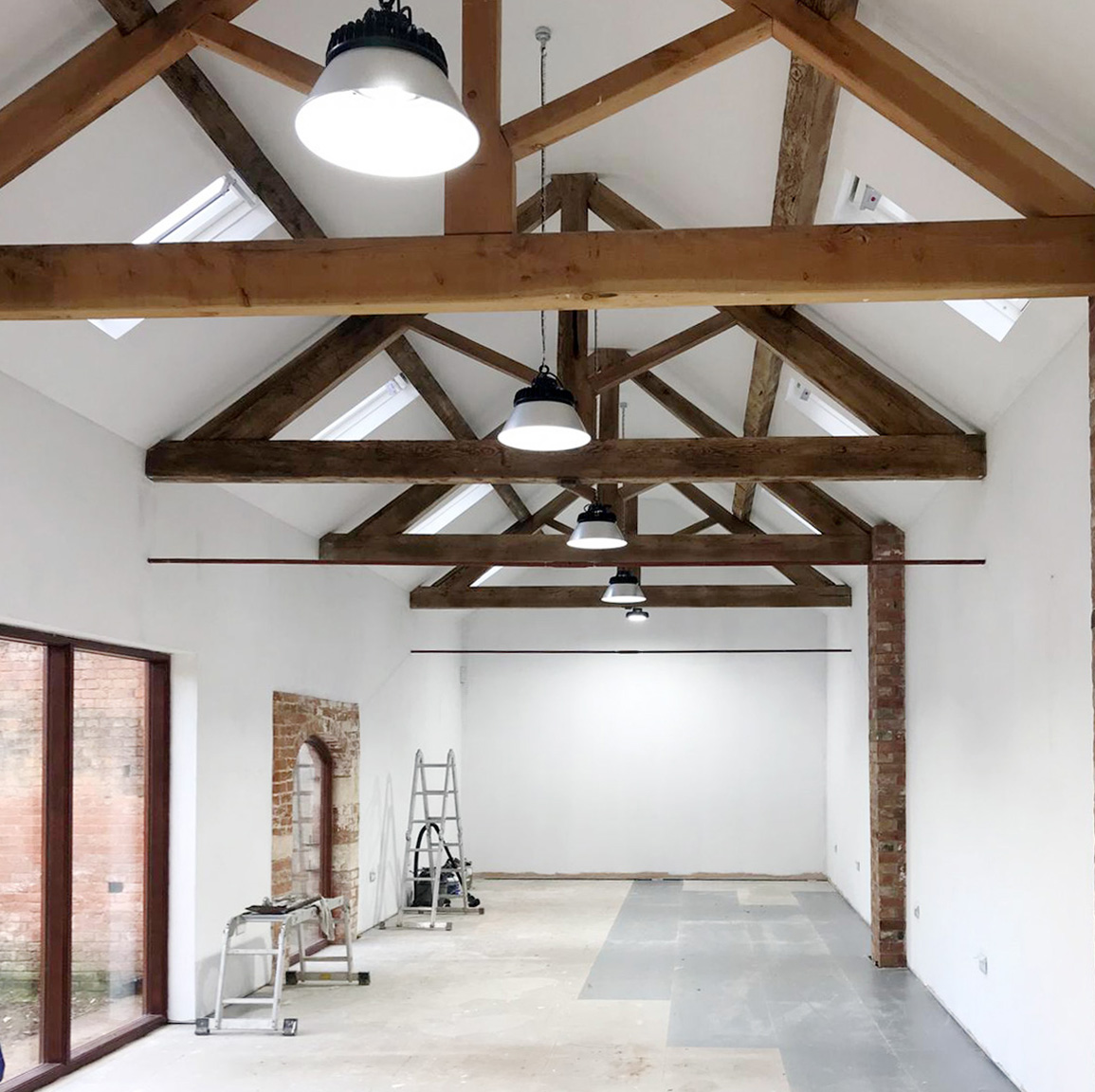 Barn conversion in Retford Nottinghamshire - freshly plastered and painted. Pitched ceiling and wooden beams