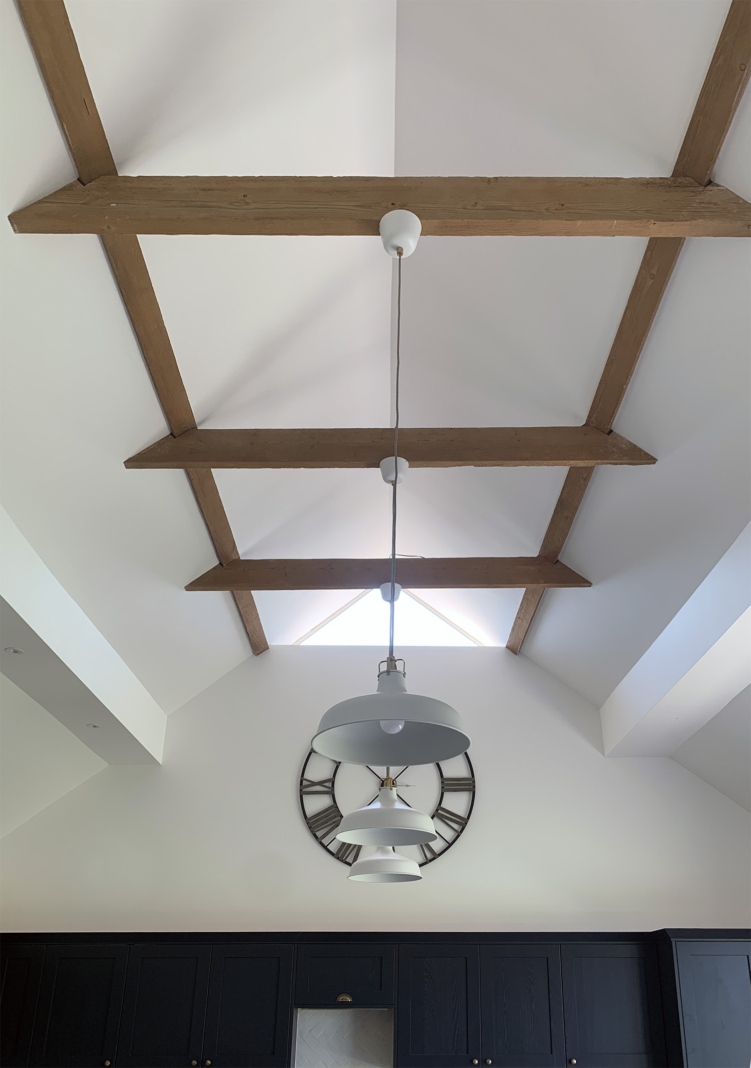 newly plastered pitched ceiling with rafters