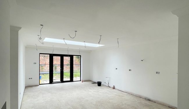 Large kitchen renovation newly plastered and painted white