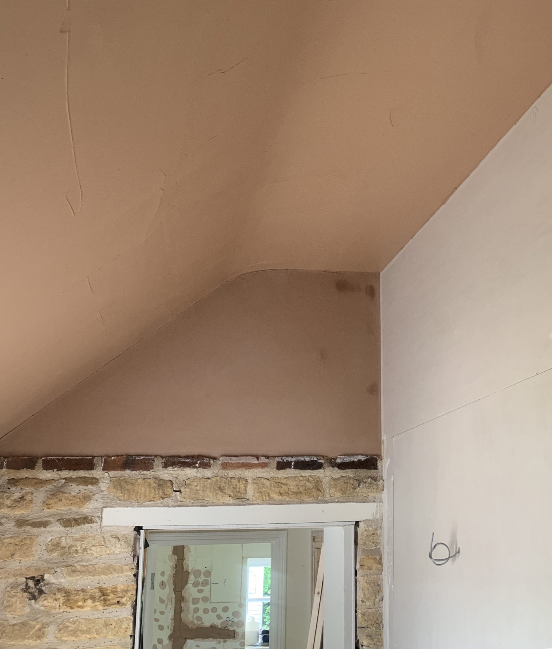 New plaster around window with curved ceiling with rustic bricks